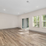 Spacious living area with wood plank flooring