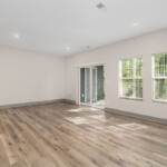 Spacious living area with wood plank flooring