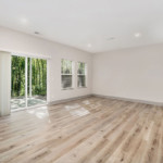 Spacious living area with wood plank flooring